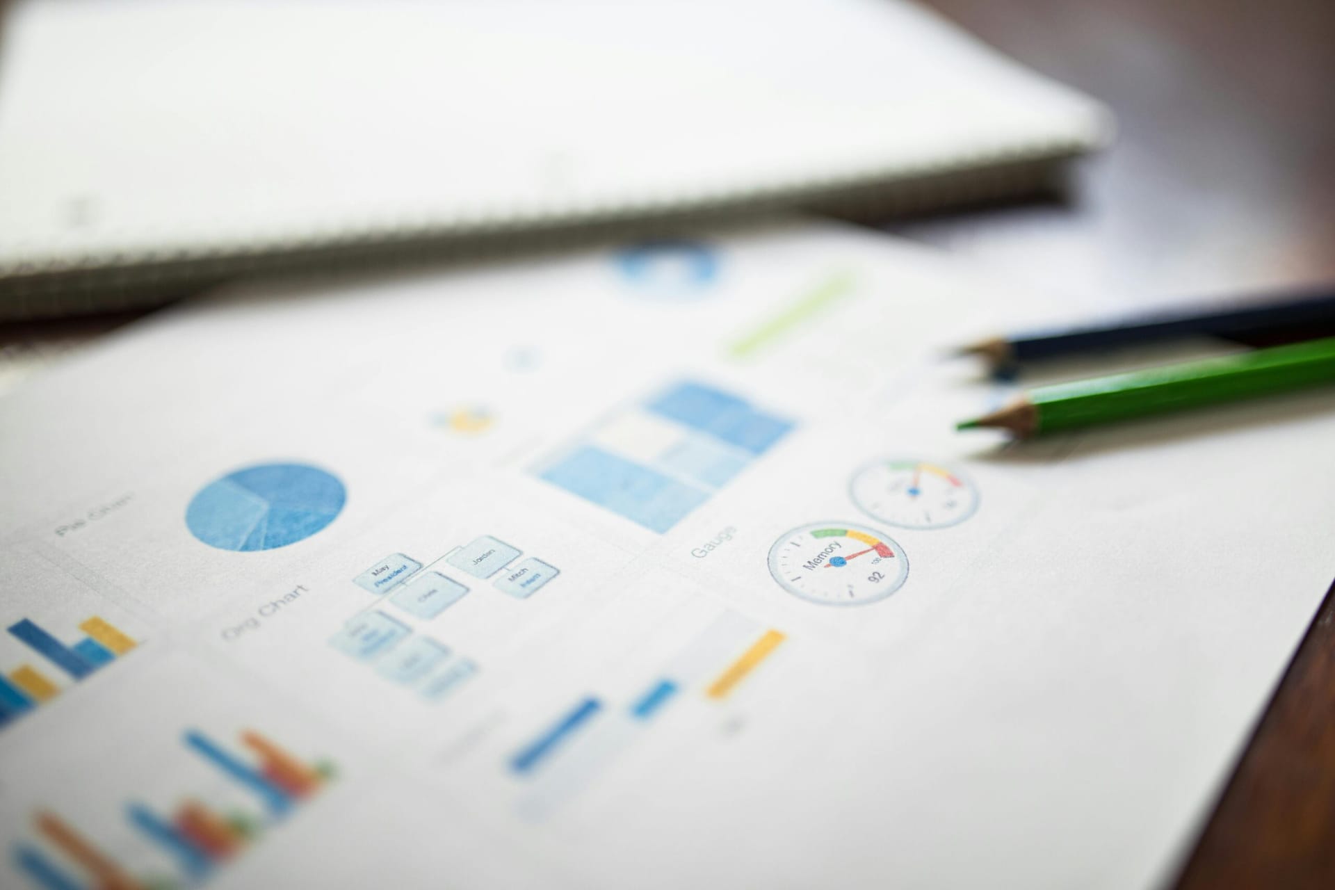 Picture of pencils and charts on paper